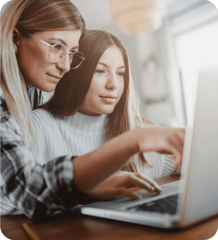 Mother and Daughter using Laptop