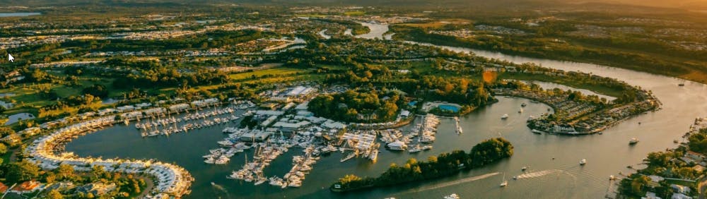 On the Coomera River  Located within the picturesque surrounds of Sanctuary Cove, the Marina enjoys direct access to the Pacific Ocean via the protected waterways of the Gold Coast Broadwater (without height restrictions) and the Coomera River.